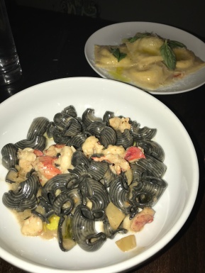 Squid ink lumache on the bottom and the stracciatelle ravioli on the top